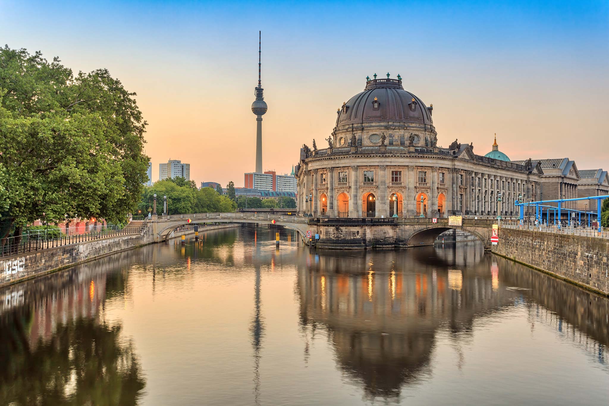 Bode Museum and Berlin TV Tower reflected in the River Spree at sunset.