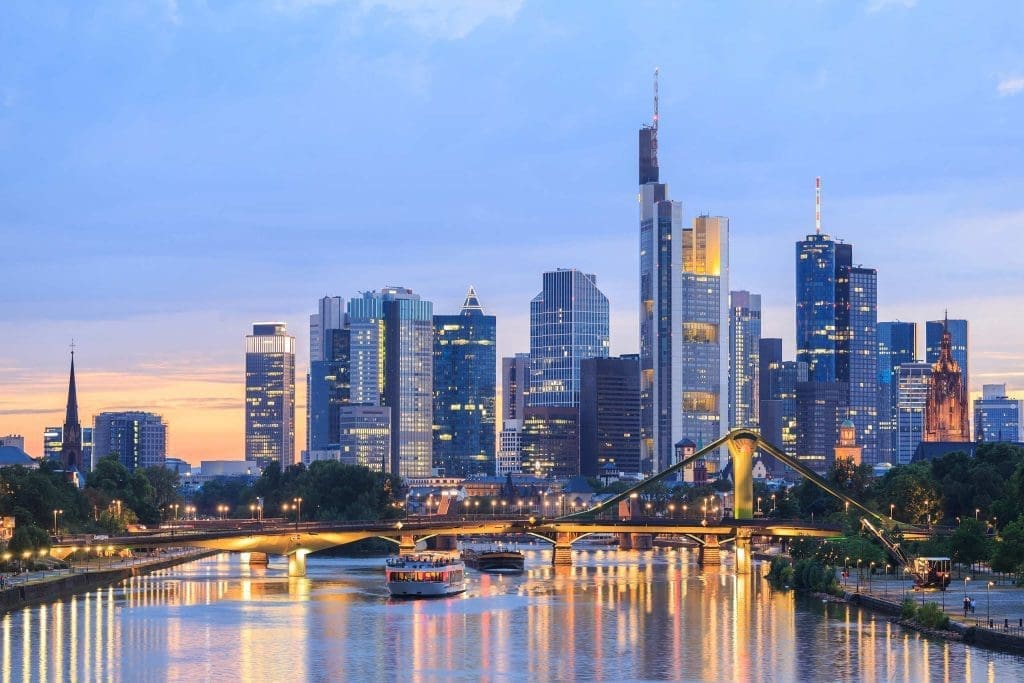 Frankfurt skyline at sunset with modern skyscrapers reflected in the River Main