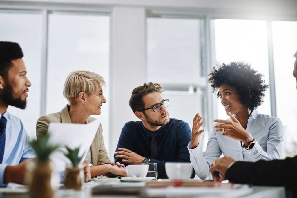 Diverse group of professionals collaborating during an office meeting