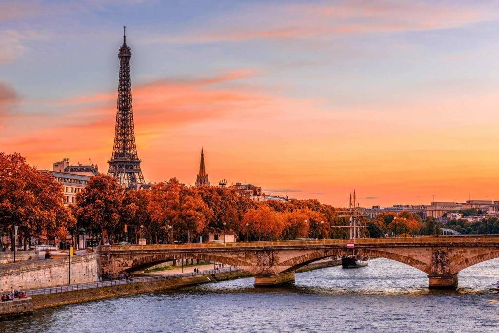 Eiffel Tower overlooking the River Seine and Paris at sunset.
