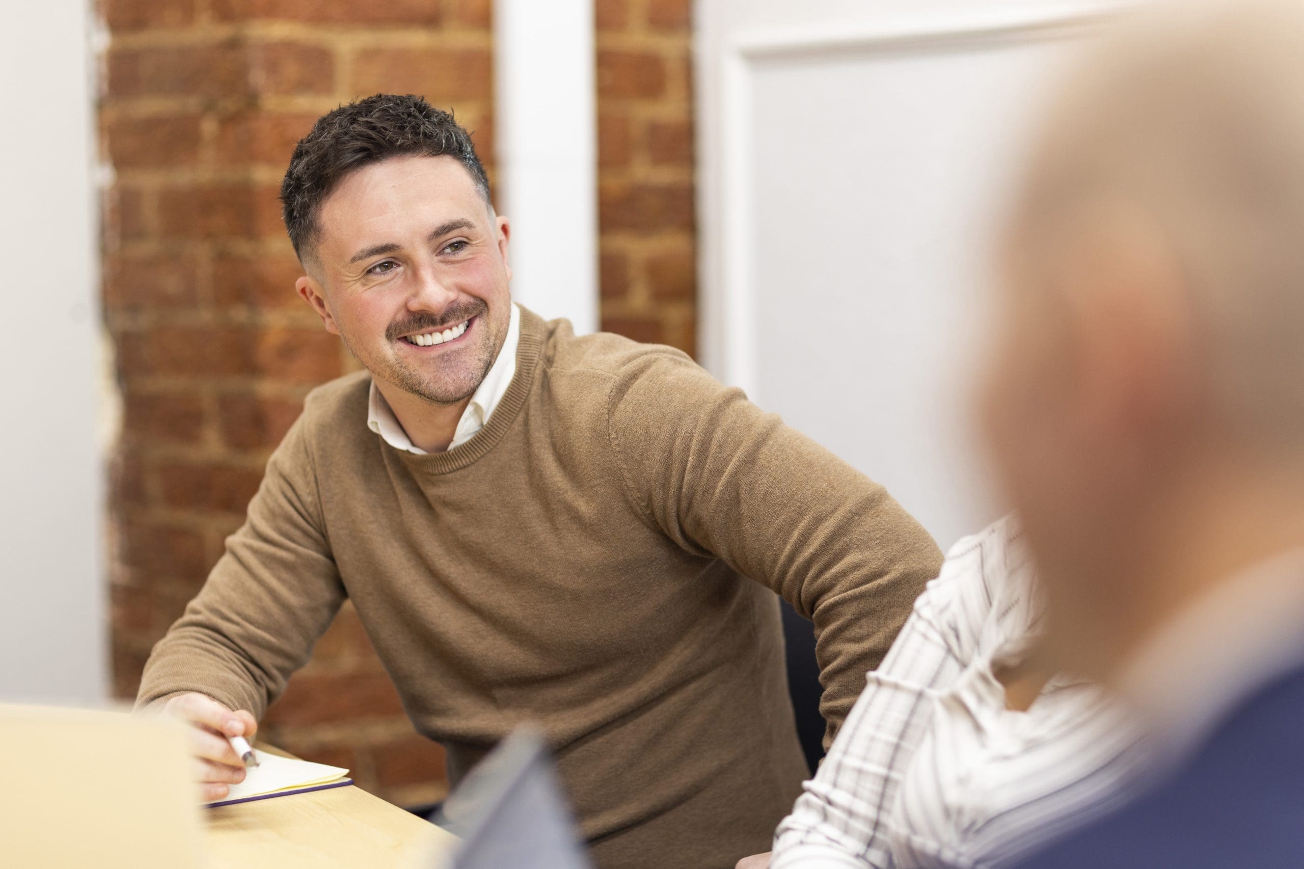 employee in a meeting in a modern office.