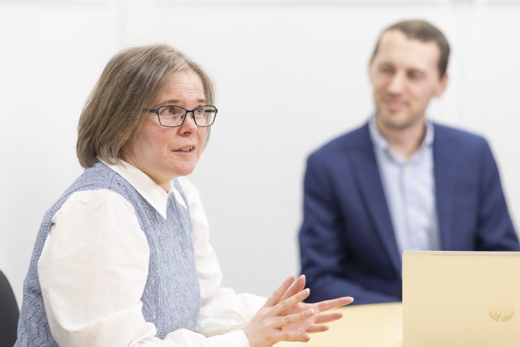 Colleagues in a meeting in a modern office.
